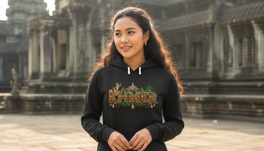 Woman wearing a black hoodie with 'Khmer' text in front of Angkor Wat.