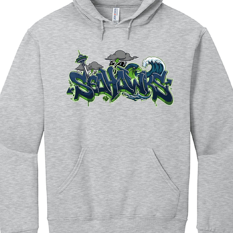 Gray hoodie with 'Seahawks' logo featuring the Space Needle and waves on a white background