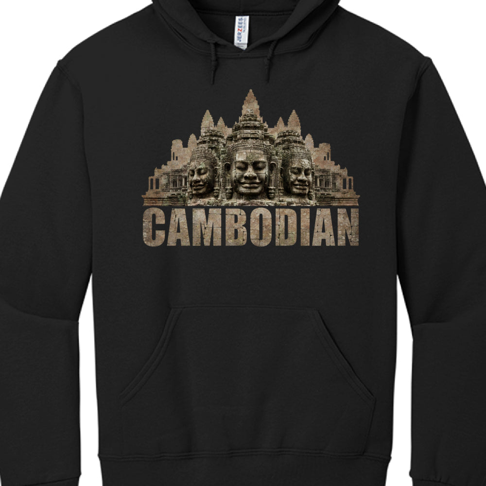 The Graphic: The central image depicts the famous stone faces of the Bayon Temple at Angkor Thom, Cambodia. These massive, serene faces are carved in the likeness of Avalokiteshvara (the bodhisattva of compassion) or King Jayavarman VII.

The Background: Behind the faces is a silhouette of the iconic five towers of Angkor Wat, rendered in a weathered, stone-like texture.

Typography: Below the architectural imagery, the word "CAMBODIAN" is printed in a bold, uppercase, block-style font. The letters have a "
