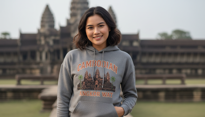 Woman wearing a hoodie with 'Cambodian' text and temple design, standing in front of Angkor Wat.