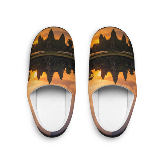 Pair of slippers with a sunset design on a white background