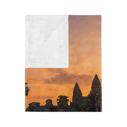 Blanket with sunset over temple design on a white background