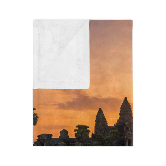 Blanket with sunset over temple design on a white background