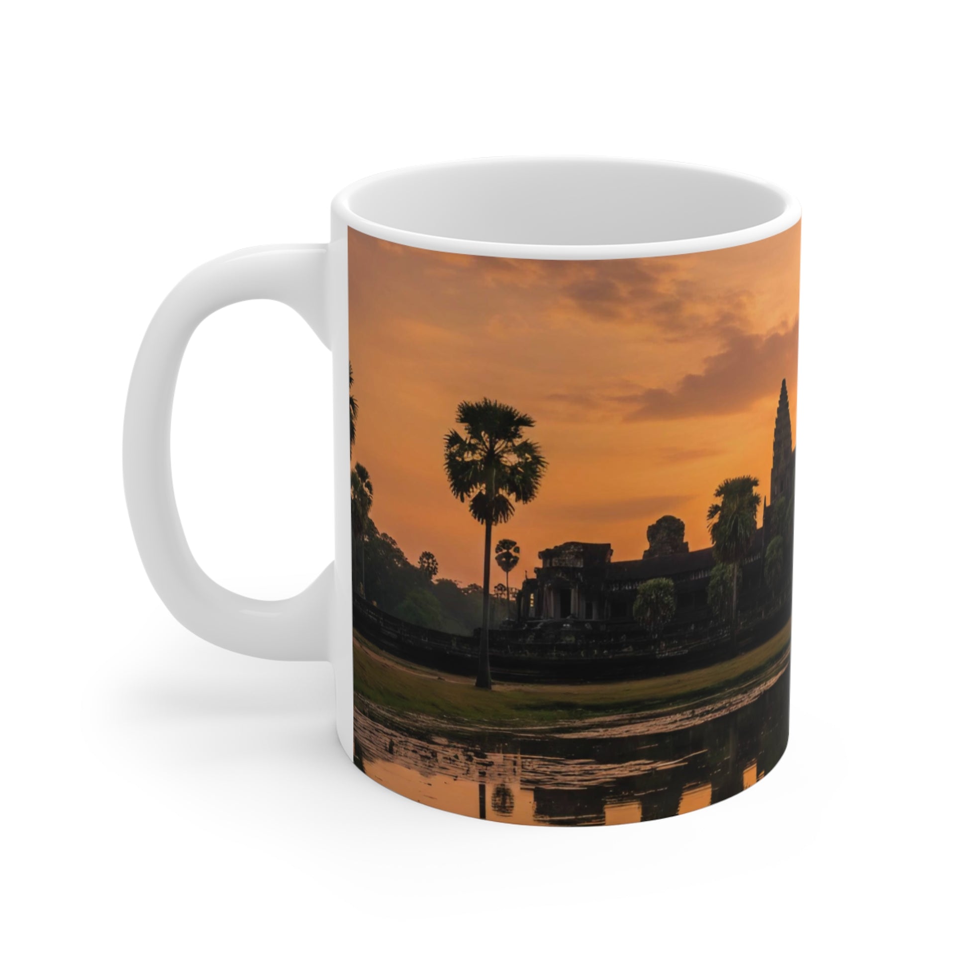 Mug with a sunset scene featuring palm trees and ruins on a white background
