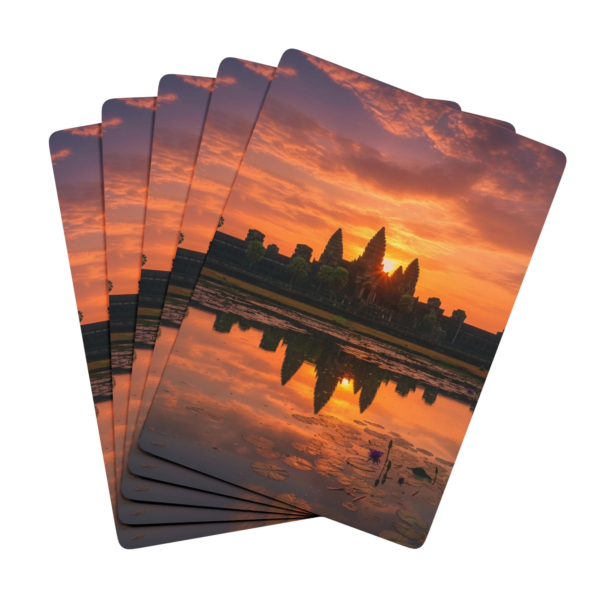 Set of playing cards with a sunset over a city skyline design.