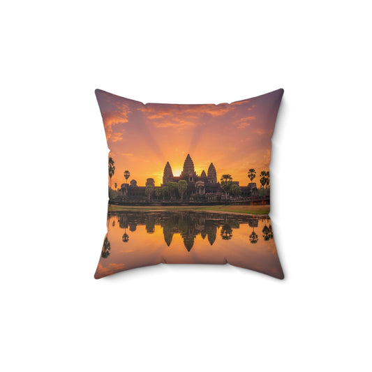 Decorative pillow with a sunset over Angkor Wat design on a white background