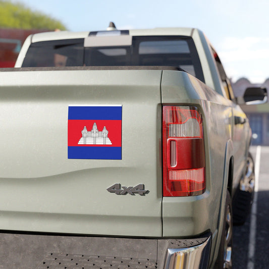 Back of a beige truck with a Cambodia flag decal on a clear day.