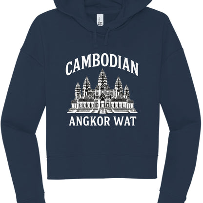 This image features a navy blue, cropped hoodie with a white graphic design centered on the chest.

Design Details
Text: The word "CAMBODIAN" is arched across the top in a white, bold serif font. Below the central illustration, the words "ANGKOR WAT" are printed in a straight, matching font.

Graphic: The center features a detailed, white line-art illustration of Angkor Wat, the famous temple complex in Cambodia, showcasing its iconic five towers (prasats) and tiered architecture.

Garment Style:

Color: De