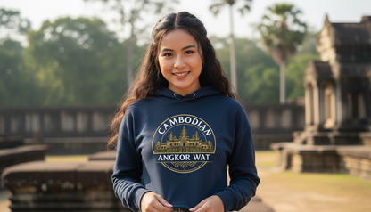 Woman wearing a hoodie with Angkor Wat design in front of temple ruins
