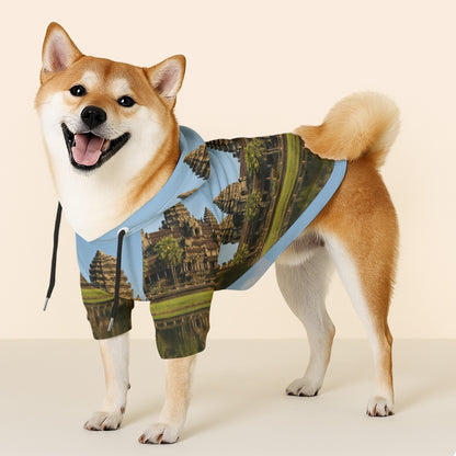 Dog wearing a hoodie with Angkor Wat design on a beige background