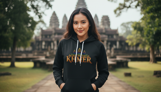 Person wearing a hoodie with text in front of Angkor Wat, Cambodia
