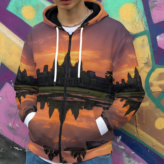 Landscape Print: The hoodie displays a vivid photographic scene of the famous Cambodian temple complex silhouetted against a dramatic orange and purple sky.

Reflection Detail: The lower half of the hoodie depicts the temple's reflection in the surrounding water, creating a symmetrical visual effect across the torso.

Accent Details: * Hardware: A black central zipper and white drawstrings for the hood.

Cuffs: Thick white elastic cuffs at the wrists.

Interior: The inside of the hood appears to be lined wi