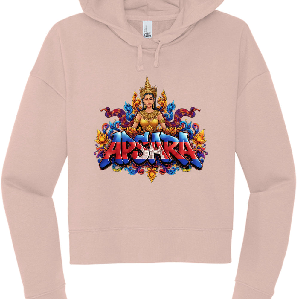 The Text: The word "APSARA" is rendered in a bold, 3D-effect font. The lettering is filled with the Cambodian flag design, featuring blue and red horizontal stripes with the white silhouette of Angkor Wat in the center.

Central Figure: Each hoodie features an illustration of an Apsara, a celestial dancer from Khmer mythology, wearing a traditional golden crown and jewelry.

Apparel Style: Both are cropped-style hoodies with a wide, ribbed waistband and cuffs, matching drawstrings, and a "DISTRICT" brand la