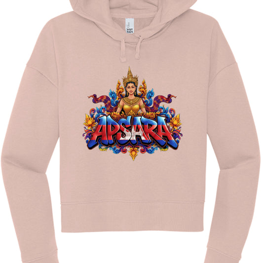The Text: The word "APSARA" is rendered in a bold, 3D-effect font. The lettering is filled with the Cambodian flag design, featuring blue and red horizontal stripes with the white silhouette of Angkor Wat in the center.

Central Figure: Each hoodie features an illustration of an Apsara, a celestial dancer from Khmer mythology, wearing a traditional golden crown and jewelry.

Apparel Style: Both are cropped-style hoodies with a wide, ribbed waistband and cuffs, matching drawstrings, and a "DISTRICT" brand la
