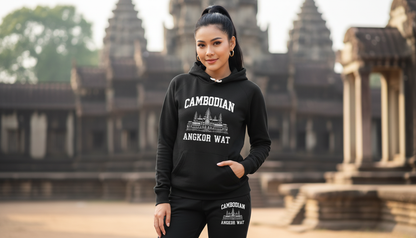 Woman wearing a black hoodie with 'Cambodian Angkor Wat' text in front of Angkor Wat temple.