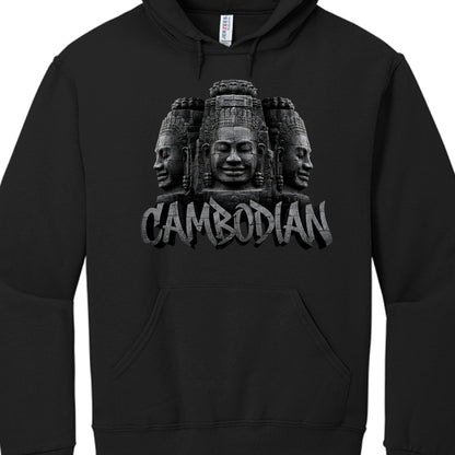 Central Graphic: A detailed depiction of three stone-carved faces, mirroring the iconic "face towers" found at the Bayon Temple.

Typography: The word "CAMBODIAN" is displayed beneath the carvings in a bold, capitalized font.

Texturing: Both the faces and the lettering utilize a weathered, cracked stone texture with grayscale shading to create a 3D effect.