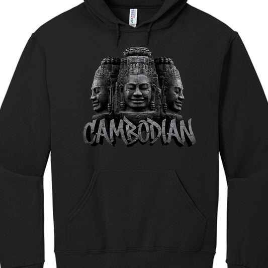 Central Graphic: A detailed depiction of three stone-carved faces, mirroring the iconic "face towers" found at the Bayon Temple.

Typography: The word "CAMBODIAN" is displayed beneath the carvings in a bold, capitalized font.

Texturing: Both the faces and the lettering utilize a weathered, cracked stone texture with grayscale shading to create a 3D effect.