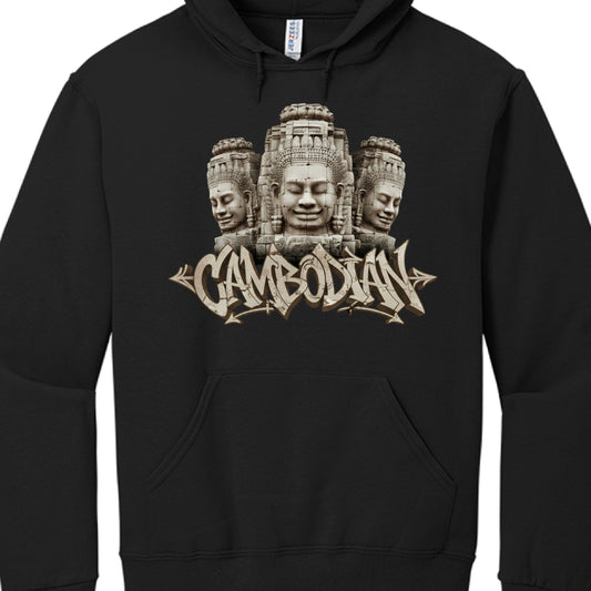 The Stone Faces: The top of the graphic depicts three detailed stone faces inspired by the Bayon Temple at Angkor Thom in Cambodia. The faces have peaceful, meditative expressions and are rendered with a weathered, textured look that mimics ancient stone carvings.

Typography: Directly beneath the faces is the word "CAMBODIAN" written in a bold, 3D graffiti-style font. The lettering features the same cracked stone texture and tan-beige coloring as the faces above.

Artistic Style: The overall design uses a 