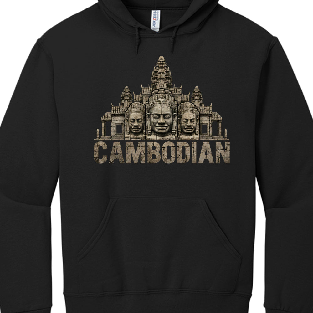 The Artwork: The primary graphic consists of three detailed stone faces, characteristic of the carvings found at the Bayon Temple in Angkor Thom.

The Background: Behind the faces is a stylized architectural silhouette of Angkor Wat, rendered in a monochromatic, stone-textured finish.

Typography: The word "CAMBODIAN" is printed in a large, bold, sans-serif font across the bottom of the design. The letters have a distressed, "cracked stone" effect to match the ancient theme of the ruins.