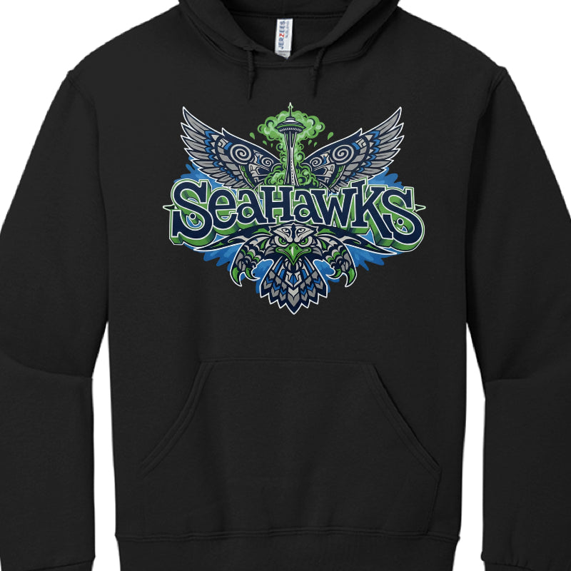 This image features a black pullover hoodie showcasing a vibrant, multi-colored graphic design. The design is centered on the chest and incorporates elements associated with the Seattle Seahawks and the city of Seattle.

Design Details
Central Imagery: The graphic features a stylized osprey (seahawk) with its wings spread wide, rendered in a Northwest Coast indigenous art style. Behind the bird, the Seattle Space Needle is visible, surrounded by a green cloud-like burst.

Typography: The word "SEAHAWKS" is 