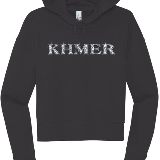 This image features a black, long-sleeved hooded sweatshirt with a bold graphic centered on the chest.

Design Details
The Text: The word "KHMER" is printed in large, uppercase, serif lettering across the chest.

The Style: The letters are filled with a rhinestone or "bling" effect, featuring white and light blue circular patterns that mimic the sparkle of diamonds. Small "glint" or starburst accents are scattered around the edges of the letters to enhance the glittering appearance.

The Hoodie: It is a sta