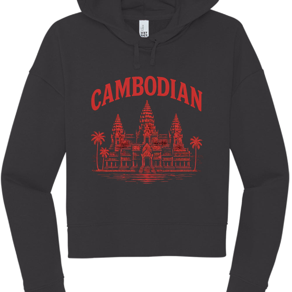 This image features a black cropped hoodie with a graphic design centered on the chest. The aesthetic blends streetwear style with cultural iconography.

Design Details
Text: The word "CAMBODIAN" is printed in a bold, red, serif font, arched across the top of the graphic.

Illustration: Below the text is a detailed red illustration of Angkor Wat, the famous temple complex in Cambodia. The artwork includes:

The iconic three-tower silhouette.

Palm trees flanking the sides of the temple.

A reflection or wat