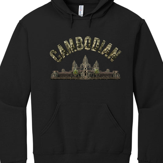 The Text: The word "CAMBODIAN" is written in an arched, block-letter font. Each letter is textured with images of the serene, carved stone faces found at the Bayon Temple.

The Central Image: Positioned directly below the text is a detailed, realistic depiction of Angkor Wat, the famous temple complex. It features the characteristic five towers and lush greenery surrounding the base.

The Hoodie: The garment is a standard black hoodie with a front "kangaroo" pocket, drawstring hood, and a visible "Jerzees" 
