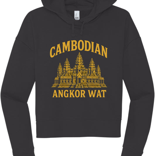 This image features a black, long-sleeved cropped hoodie with a graphic design centered on the chest. The aesthetic is reminiscent of university or travel souvenir apparel.

Design Details
Color Palette: The garment is a matte black, while the printed graphic is a vibrant golden yellow.

Central Graphic: A detailed, stylized illustration of Angkor Wat, the famous temple complex in Cambodia, showing its iconic five towers (quincunx) and tiered architectural structure.

Text: * The word "CAMBODIAN" is arched 