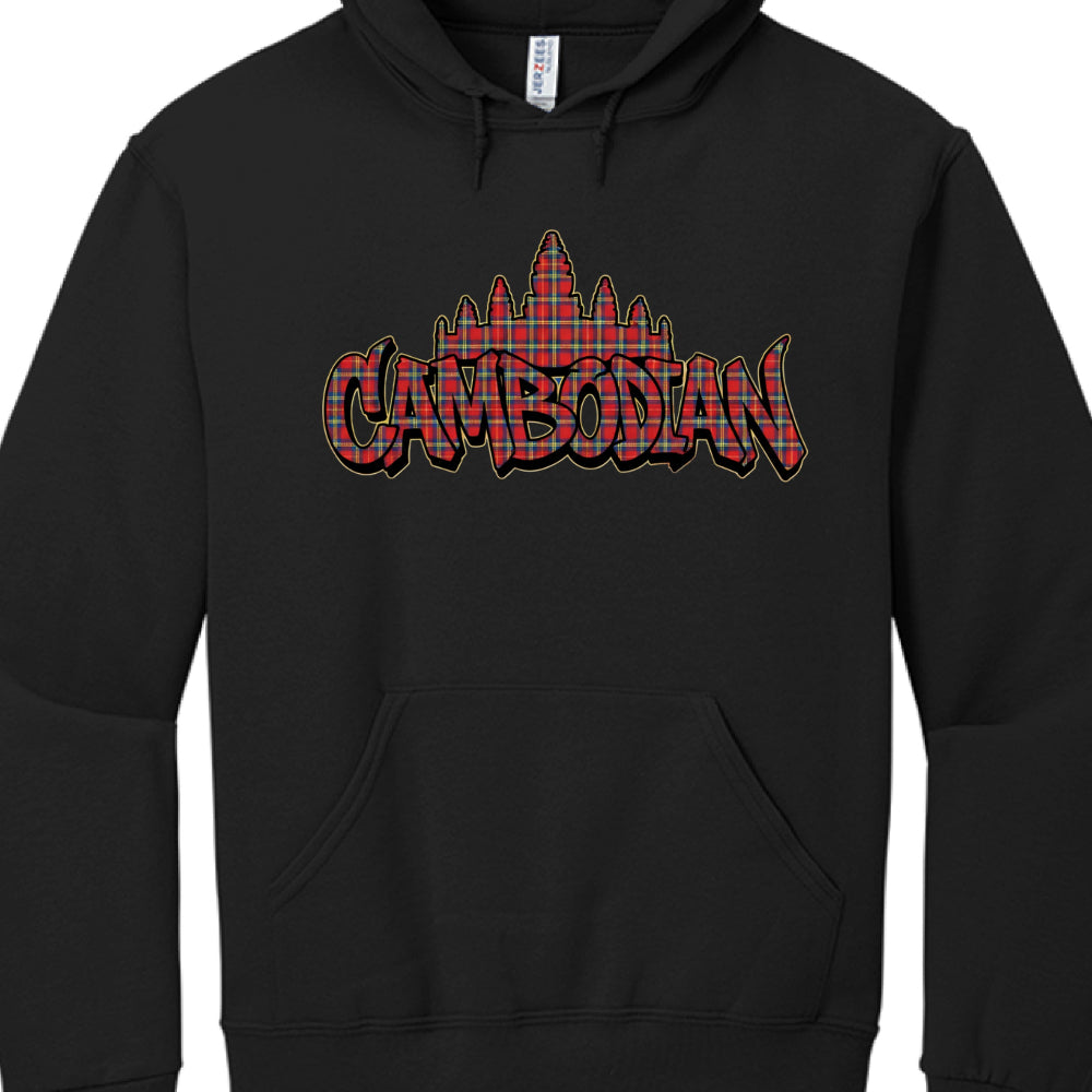 Typography: The word "CAMBODIAN" is displayed in large, bold graffiti-style letters across the chest.

Symbolism: A silhouette of the Angkor Wat temple complex sits directly behind the text.

Pattern & Color: Both the lettering and the temple silhouette are filled with a red, blue, and yellow plaid (tartan) pattern.

Visual Effects: The graphic features a heavy black outline with a thin yellow or gold stroke, giving it a three-dimensional, layered appearance against the black fabric.