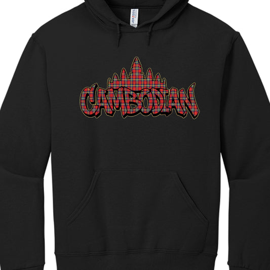 Typography: The word "CAMBODIAN" is displayed in large, bold graffiti-style letters across the chest.

Symbolism: A silhouette of the Angkor Wat temple complex sits directly behind the text.

Pattern & Color: Both the lettering and the temple silhouette are filled with a red, blue, and yellow plaid (tartan) pattern.

Visual Effects: The graphic features a heavy black outline with a thin yellow or gold stroke, giving it a three-dimensional, layered appearance against the black fabric.