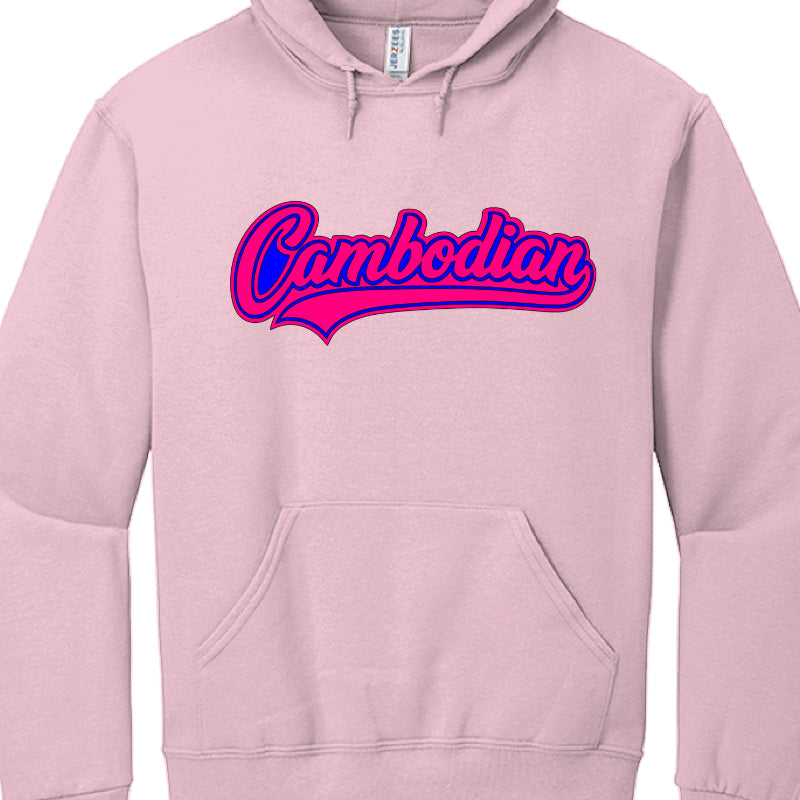 This image features a light pink, long-sleeved hooded sweatshirt with a front kangaroo pocket and drawstrings at the neckline.

The focal point is a large graphic centered on the chest:

Text: The word "Cambodian" is written in a stylized, cursive script font.

Design Style: The lettering features a "tail" or "swoosh" underlining the word, reminiscent of vintage American baseball jerseys.

Colors: The text is a vibrant blue, outlined with a thick magenta/hot pink border, which is then further outlined by a 