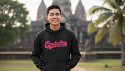 Person wearing a black hoodie with 'Canadian' printed on it, standing in front of a temple.