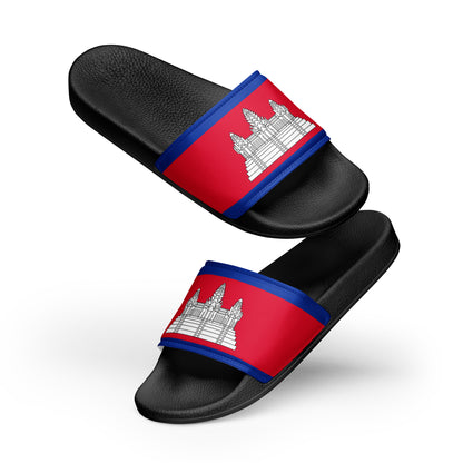 Women's Sandals, The Straps: Each sandal features a wide strap printed with the national flag of Cambodia. This design includes two horizontal blue stripes at the top and bottom, bordering a central red section that features the white silhouette of Angkor Wat.

The Material: The footbeds and straps have a distinct, textured leather-like grain.

The Composition: The sandals are shown in a dynamic "floating" arrangement, with the right sandal angled above the left one to provide a clear view of both the top d