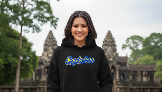 Woman wearing a hoodie with 'Cambodian' text in front of Angkor Wat.