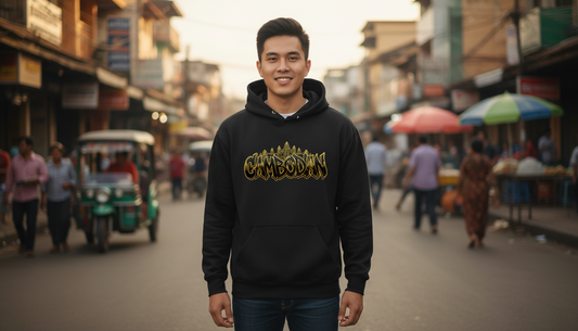 Man wearing a black hoodie with gold text on a busy street