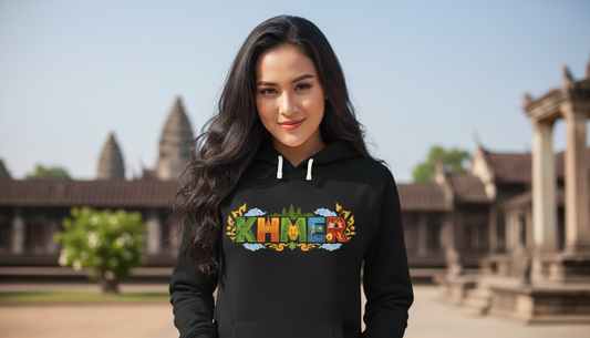 Woman wearing a black hoodie with 'Khmer' printed on it, standing in front of temple architecture.