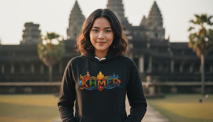 Person wearing a hoodie with colorful text in front of Angkor Wat.