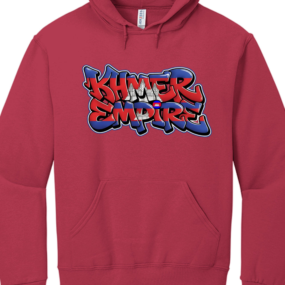 Typography: The words "KHMER EMPIRE" are rendered in a thick, bubble-style graffiti font with a layered 3D effect.

National Symbolism: The lettering is filled with the horizontal blue and red stripes of the Cambodian flag. A white silhouette of Angkor Wat is centered between the two words.

Visual Styling: The design is outlined in high-contrast white and black to ensure it stands out clearly against the maroon fabric.