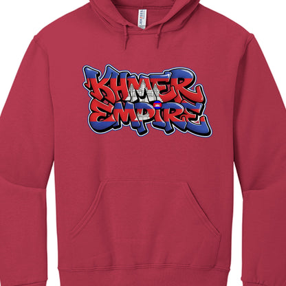 Typography: The words "KHMER EMPIRE" are rendered in a thick, bubble-style graffiti font with a layered 3D effect.

National Symbolism: The lettering is filled with the horizontal blue and red stripes of the Cambodian flag. A white silhouette of Angkor Wat is centered between the two words.

Visual Styling: The design is outlined in high-contrast white and black to ensure it stands out clearly against the maroon fabric.