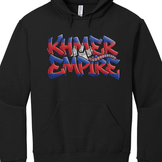 The central focus of the artwork is the text "KHMER EMPIRE" rendered in a bold, stylized font.

Lettering: The letters are filled with the colors of the Cambodian flag—horizontal stripes of blue and red. A white silhouette of Angkor Wat is integrated into the middle of the words.

Decorative Element: A small, traditional Krama (checkered scarf) graphic is draped across the right side of the lettering.

Artistic Style: The design uses a 3D, graffiti-inspired aesthetic with sharp edges and subtle highlights, 