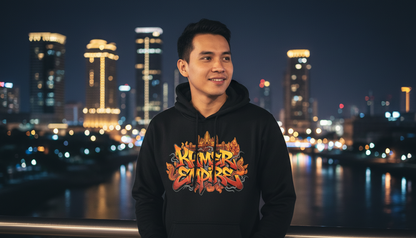 Man wearing a black hoodie with a colorful logo against a city skyline at night.
