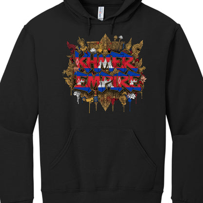 This is an image of a black pullover hoodie featuring a large, vibrant graphic on the chest centered around Cambodian heritage.

Design Breakdown
The central focus of the artwork is the text "KHMER EMPIRE" rendered in a bold, 3D graffiti style.

Lettering: The letters are filled with the colors and symbols of the Cambodian flag—horizontal stripes of blue and red with the white silhouette of Angkor Wat integrated into the middle of the words.

Background Elements: Behind the graffiti, there is a dense, intri