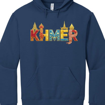 The Word "KHMER": Each letter is rendered in a thick, gold-outlined font and filled with traditional colors and textures.

K: Features a red-toned, ornate pattern and is topped with a silhouette of an Angkor Wat-style spire.

H: Wrapped in a red and gold Naga (serpent) motif.

M: Filled with a blue floral/lotus pattern, representing traditional Cambodian silk or temple carvings.

E: Topped with a pointed crown (Mokot), often seen in Apsara dance or royal imagery.

R: Draped with a red-and-white checkered Kr