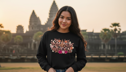 Woman wearing a black sweatshirt with 'Killer Queen' text in front of Angkor Wat.