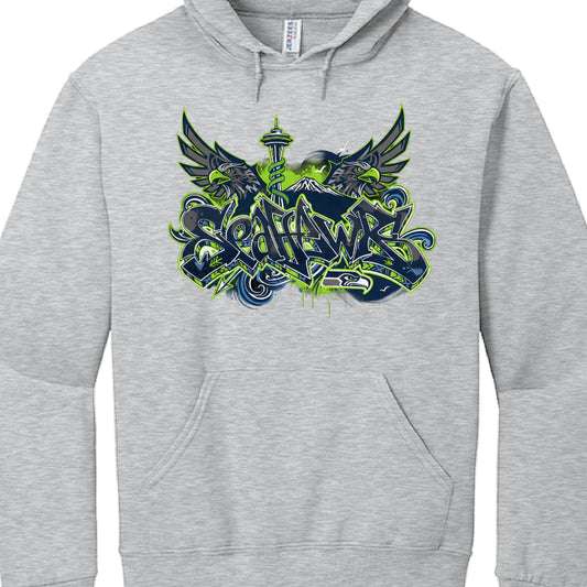 This image shows a navy blue hooded sweatshirt featuring a stylized graphic for the Seattle Seahawks.

Apparel Details
Garment: This is a pullover hoodie with a front "kangaroo" pocket and matching drawstrings.

Brand: The interior tag identifies it as a Jerzees brand sweatshirt, likely a "NuBlend" pill-resistant fleece made from a 50/50 cotton/polyester blend.

Graphic Design Composition
The artwork is a complex, multi-layered design that blends sports fandom with urban street art and Indigenous cultural m