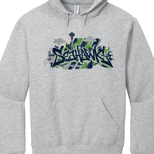 Gray hoodie with 'Seahawks' graffiti-style text and Space Needle graphic on a white background