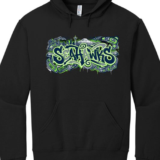 These two images feature variation designs for Seattle Seahawks hoodies, both utilizing a Jerzees brand base but with distinct artistic layouts.

Image 1: Navy Blue "Graffiti & Icons" Design
This design focuses on clean, sharp lines and specific Seattle landmarks.

Typography: The word "Seahawks" is rendered in a jagged, street-art font with a dark navy fill and a bright "Action Green" outline.

Central Icons: Directly above the text sits the Space Needle, a realistic osprey in flight, and a Washington Stat
