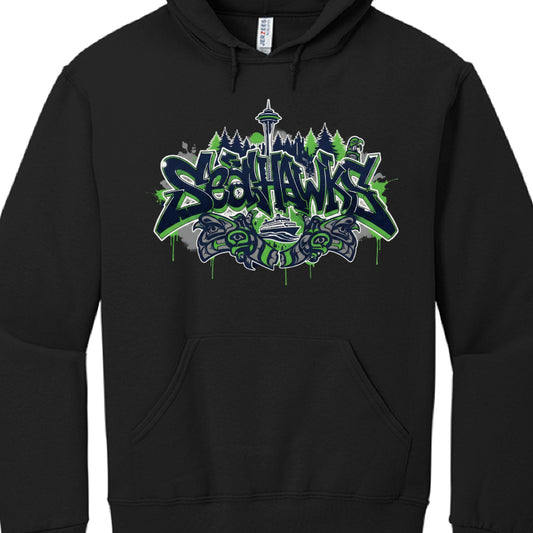 The provided images showcase three different hoodie designs for the Seattle Seahawks, each utilizing a mix of urban graffiti styles and traditional Pacific Northwest motifs.

Urban Skyline Design (image_a4655b.jpg)
This black hoodie features a graphic focused on Seattle's cityscape:

Typography: The word "SEAHAWKS" is rendered in a sharp, 3D graffiti-style font.

Skyline: A black silhouette of the Seattle skyline, including the Space Needle and the Seattle Great Wheel, sits behind the text.

Accents: Blue a
