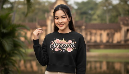 Woman wearing a black sweatshirt with 'Srolanh' design in an outdoor setting