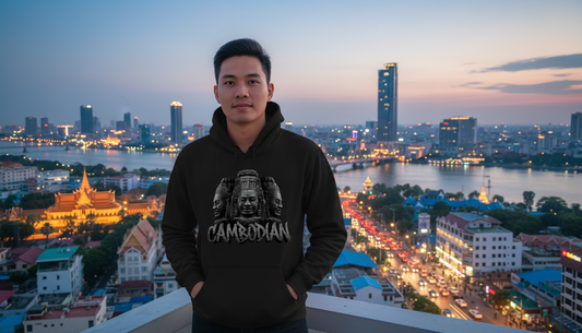 Person wearing a black hoodie with a cityscape in the background